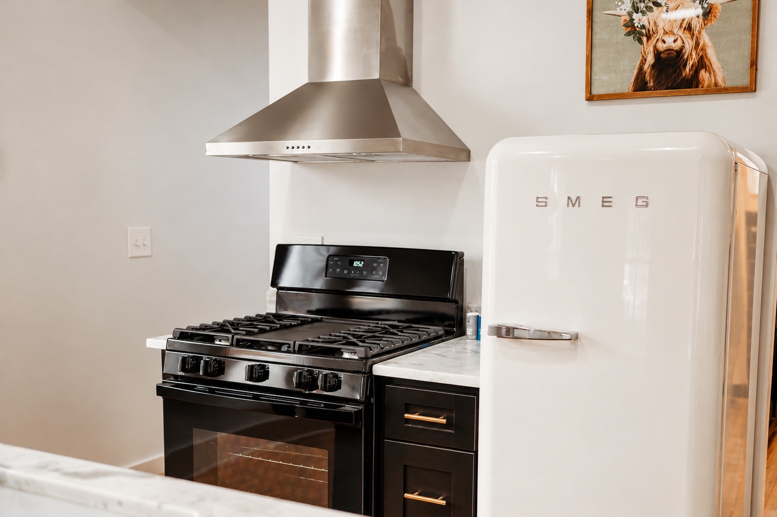 Gas range with stainless hood and retro-style refrigerator