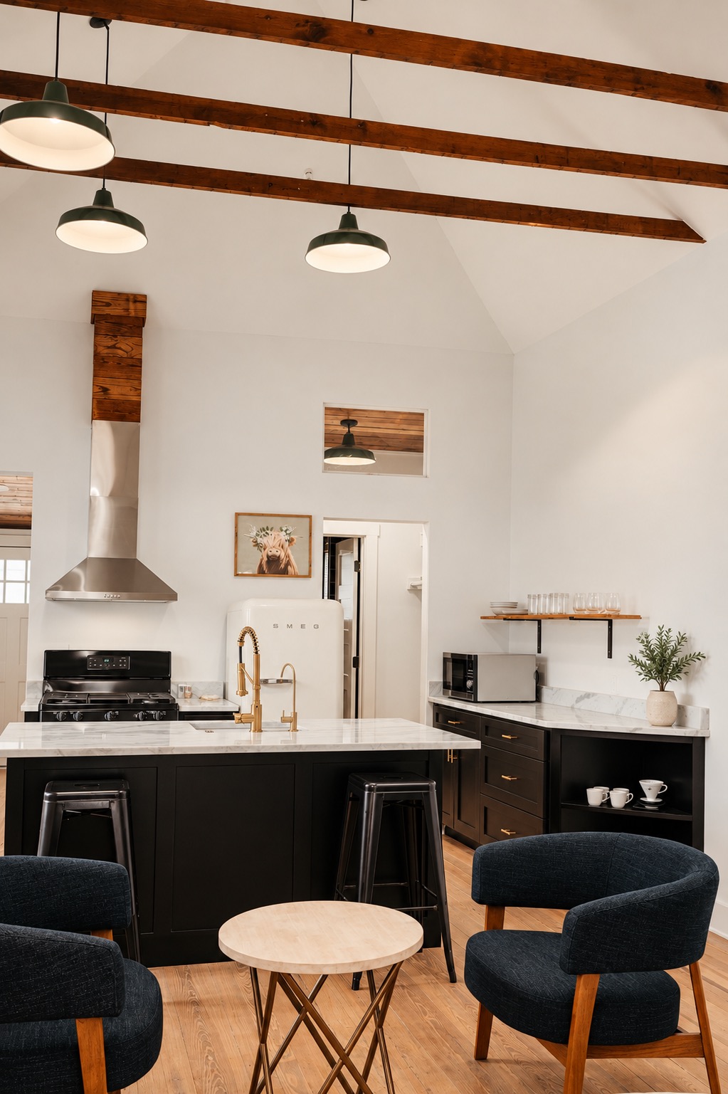 Renovated kitchen with dark cabinetry and island